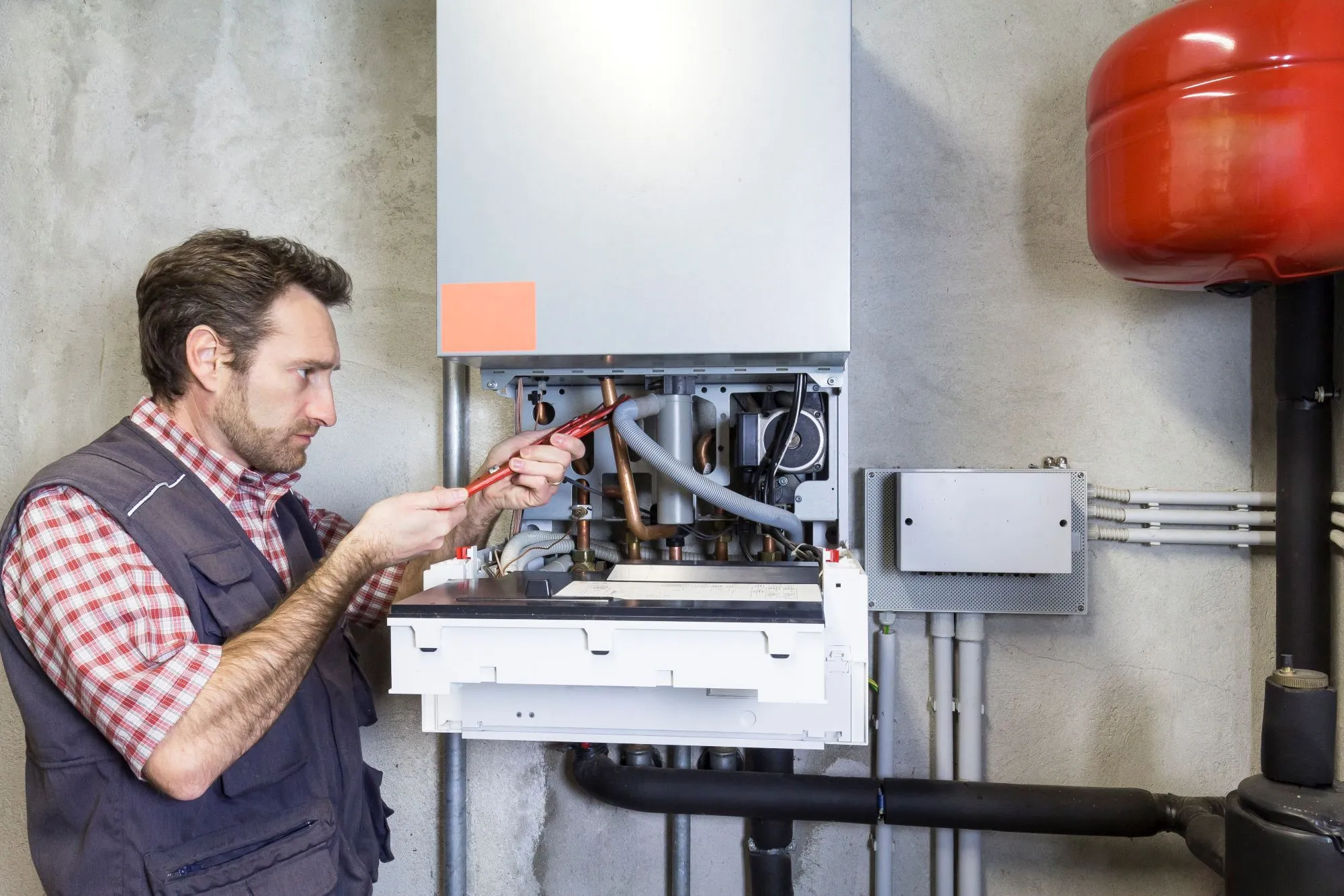 plumber repairing heating system
